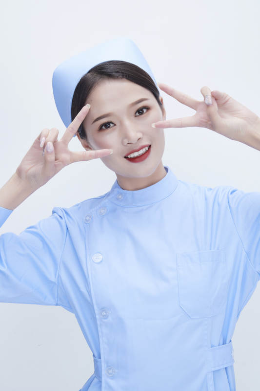 身穿蓝色护士服展示各种表情的漂亮女护士图片