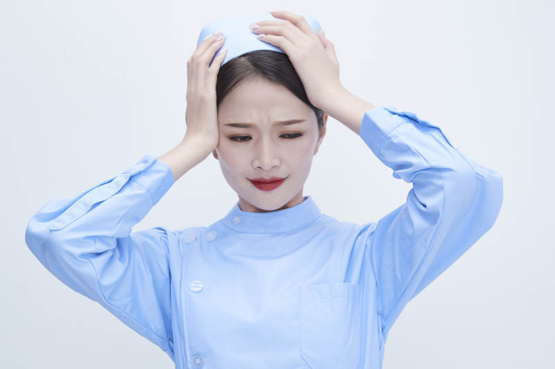 身穿蓝色护士服展示各种表情的漂亮女护士图片