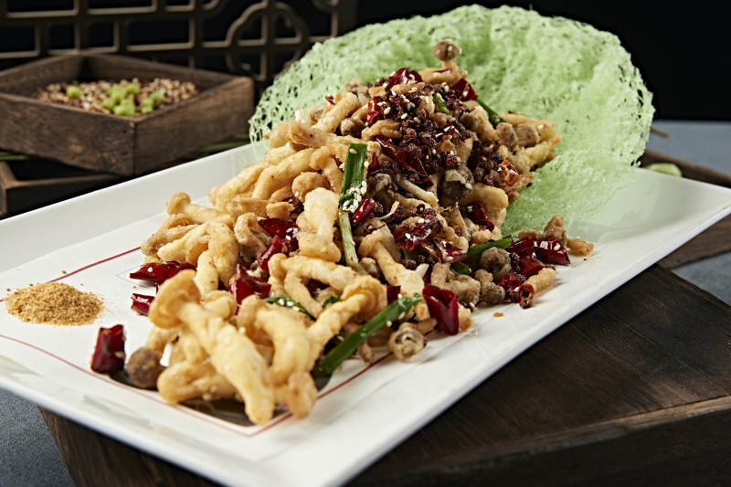 川味麻辣干炸海鲜菇图片