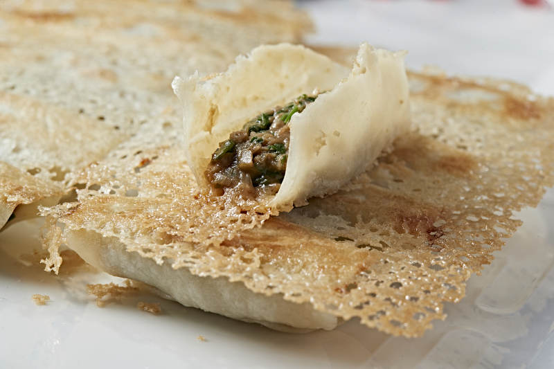 韭菜油渣馅渔网煎锅贴图片