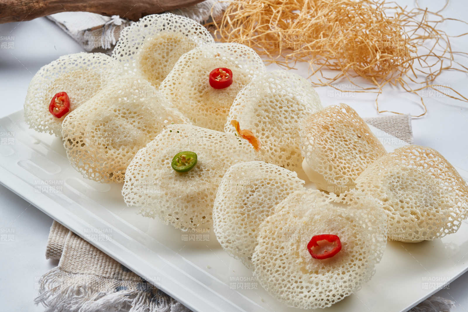 雪花渔网水煎包图片