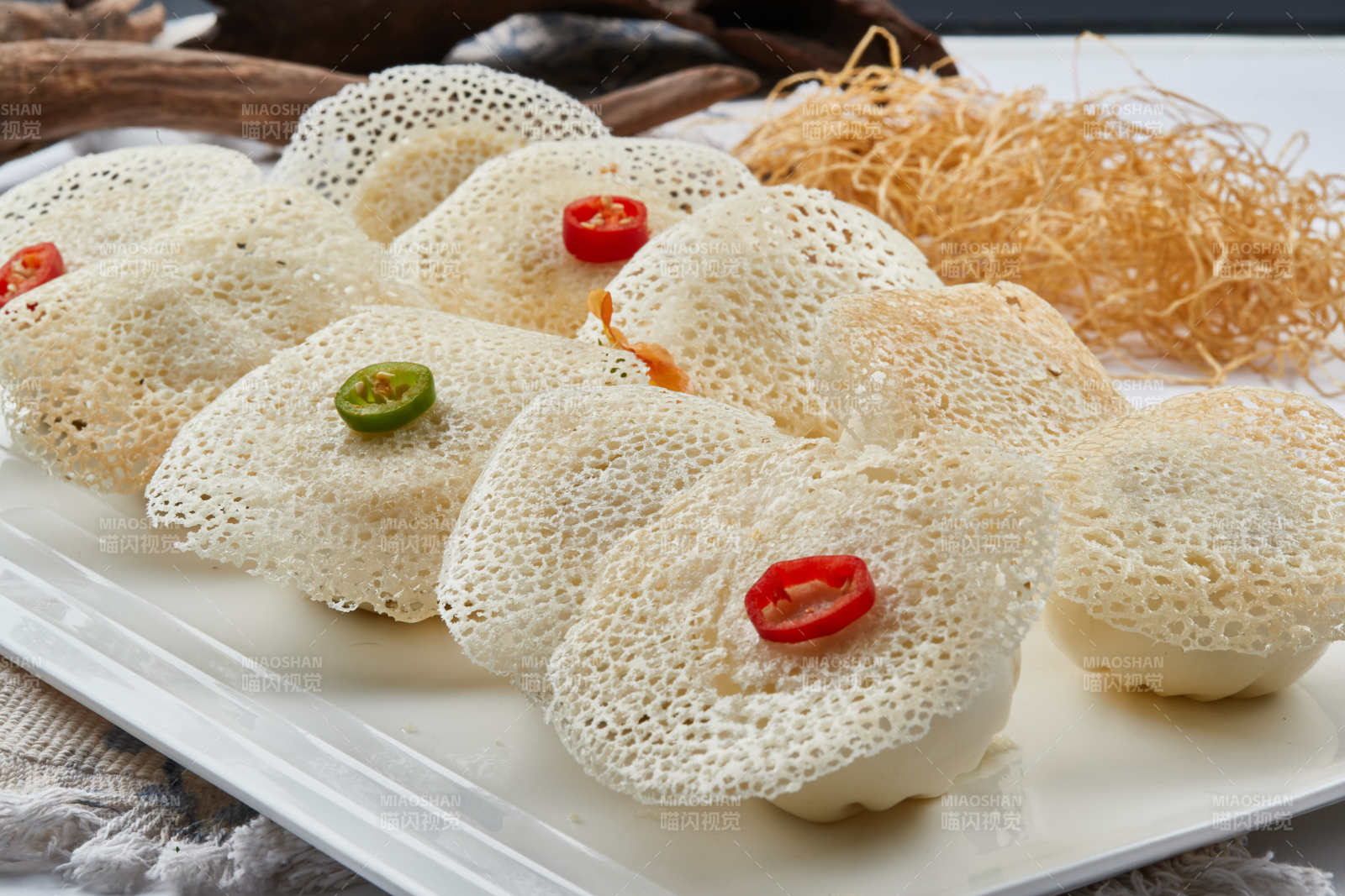 雪花渔网水煎包图片