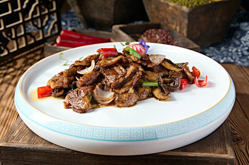 黑椒酱爆塞外口蘑牛仔肉图片