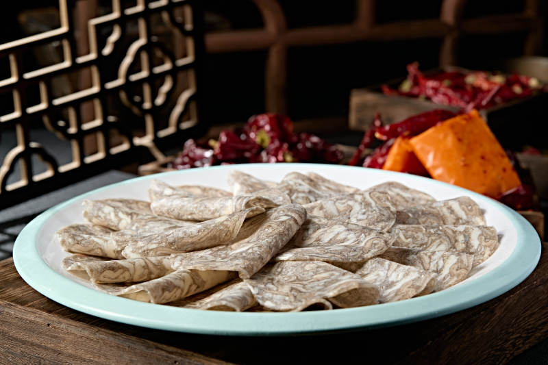 川渝火锅涮品乌鸡肉卷切片图片