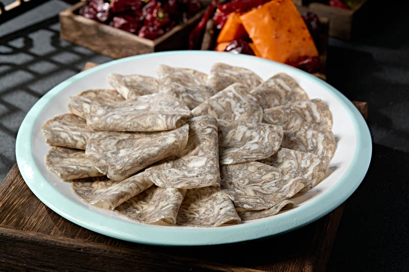 川渝火锅涮品乌鸡肉卷切片图片