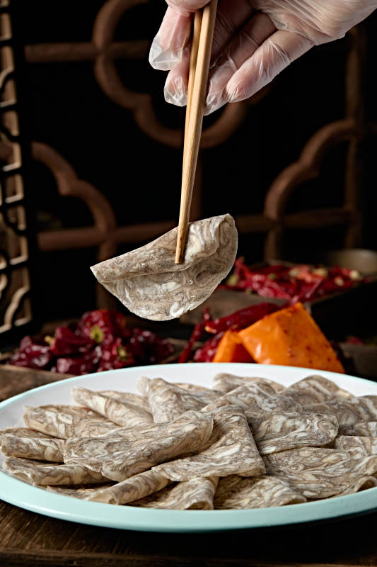 川渝火锅涮品乌鸡肉卷切片图片