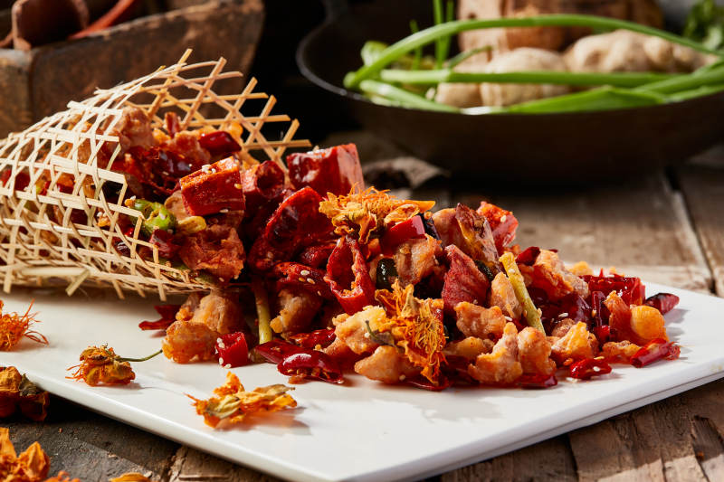 金莲花竹楼辣炒鸡脆骨图片
