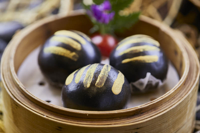 港式茶餐黑米摸金流沙包图片