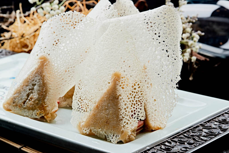 雪花渔网水煎包图片