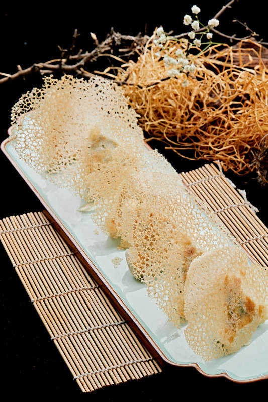 雪花渔网水煎包图片