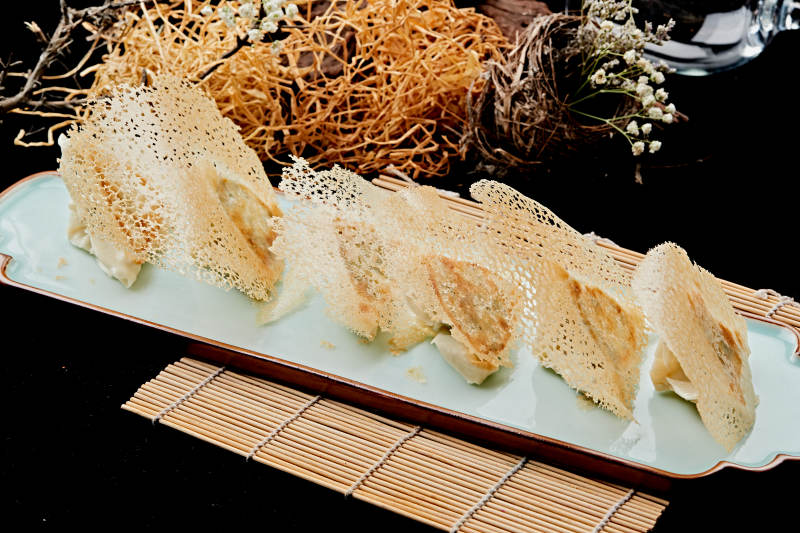 雪花渔网水煎包图片