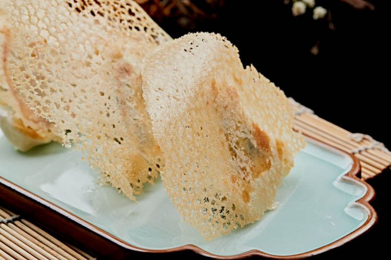 雪花渔网水煎包图片