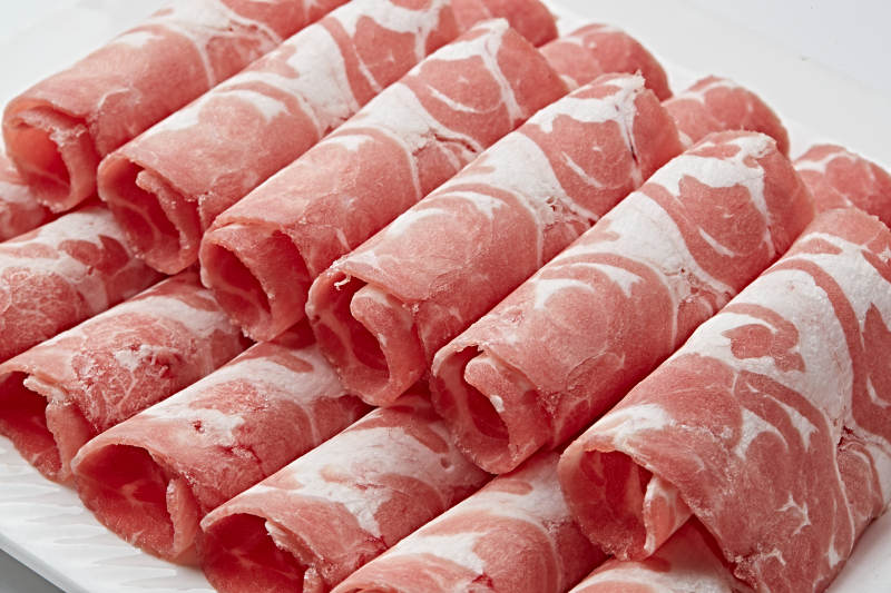 草原肥羊肉卷切片图片