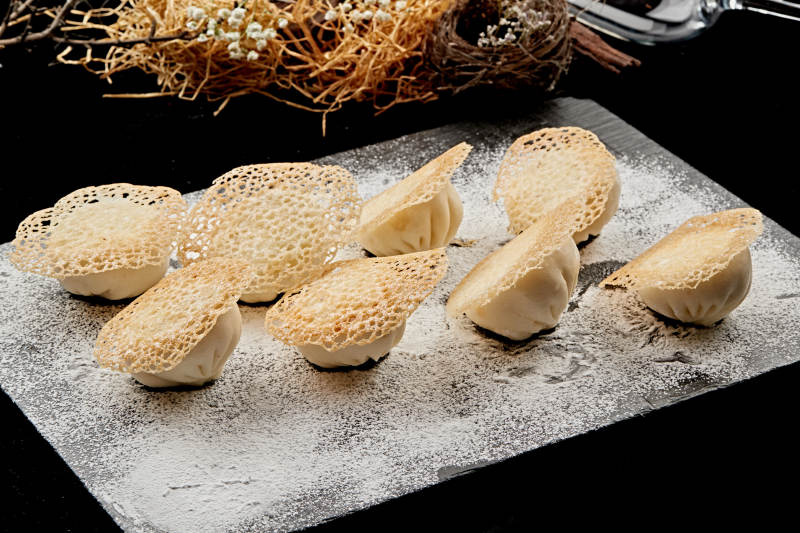 雪花渔网水煎包图片