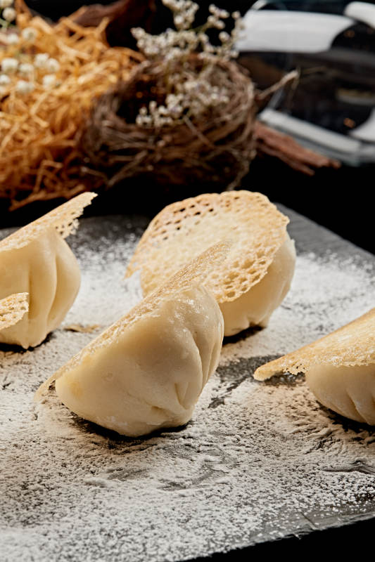 雪花渔网水煎包图片