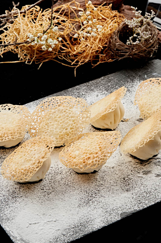 雪花渔网水煎包图片