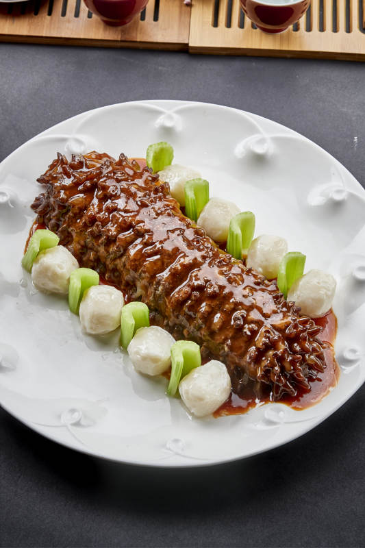 红烧寿桃梅花参配手打墨鱼丸图片