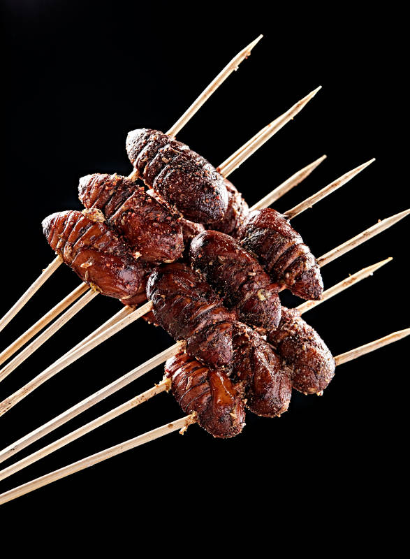 风味炭烤蚕蛹图片