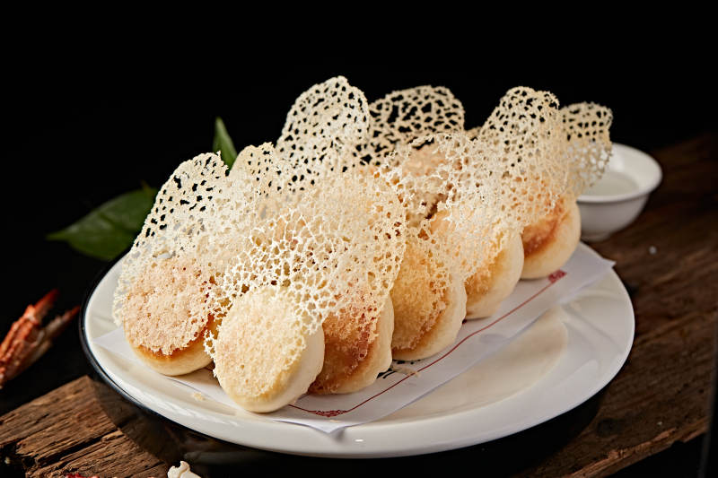 雪花渔网水煎包图片