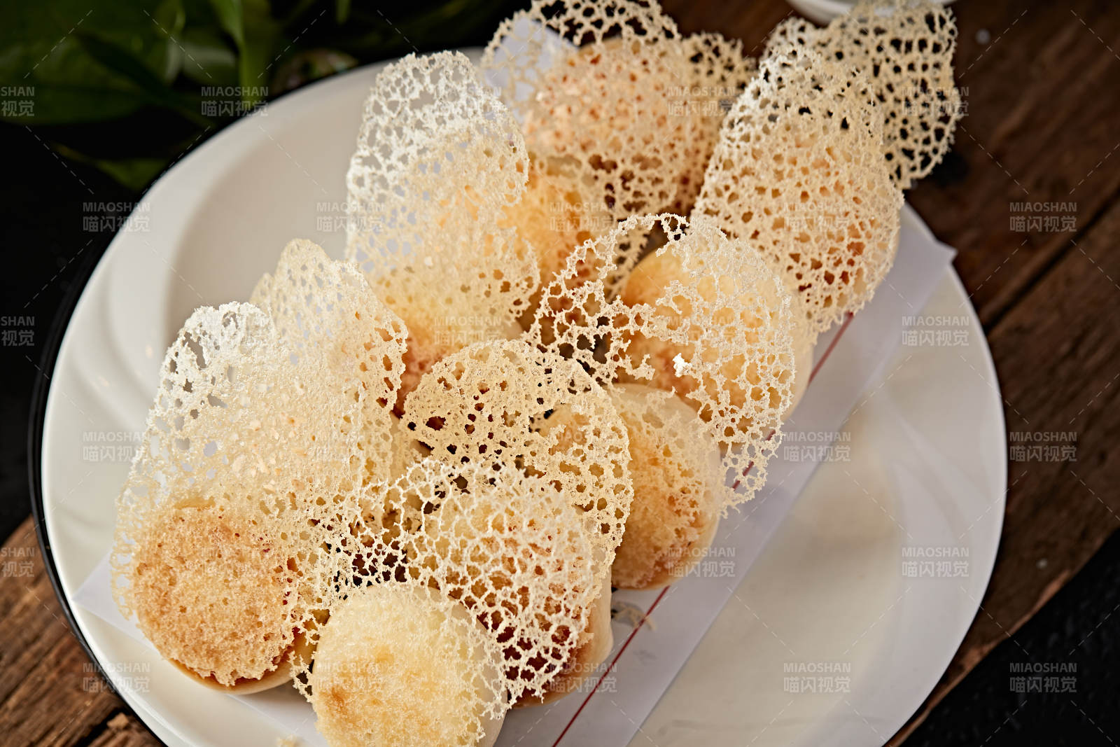 雪花渔网水煎包图片