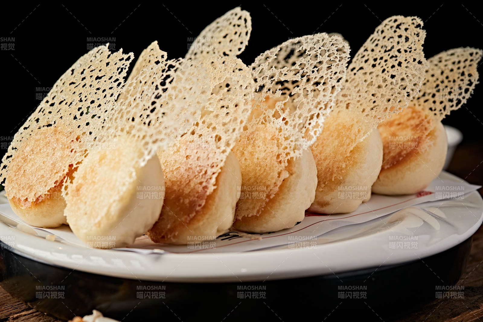 雪花渔网水煎包图片