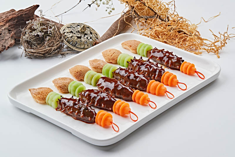 毛笔造型的浇汁梅花参图片