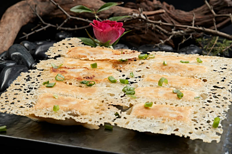 王将渔网水煎饺子图片