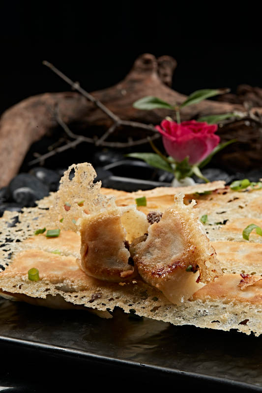 王将渔网水煎饺子图片