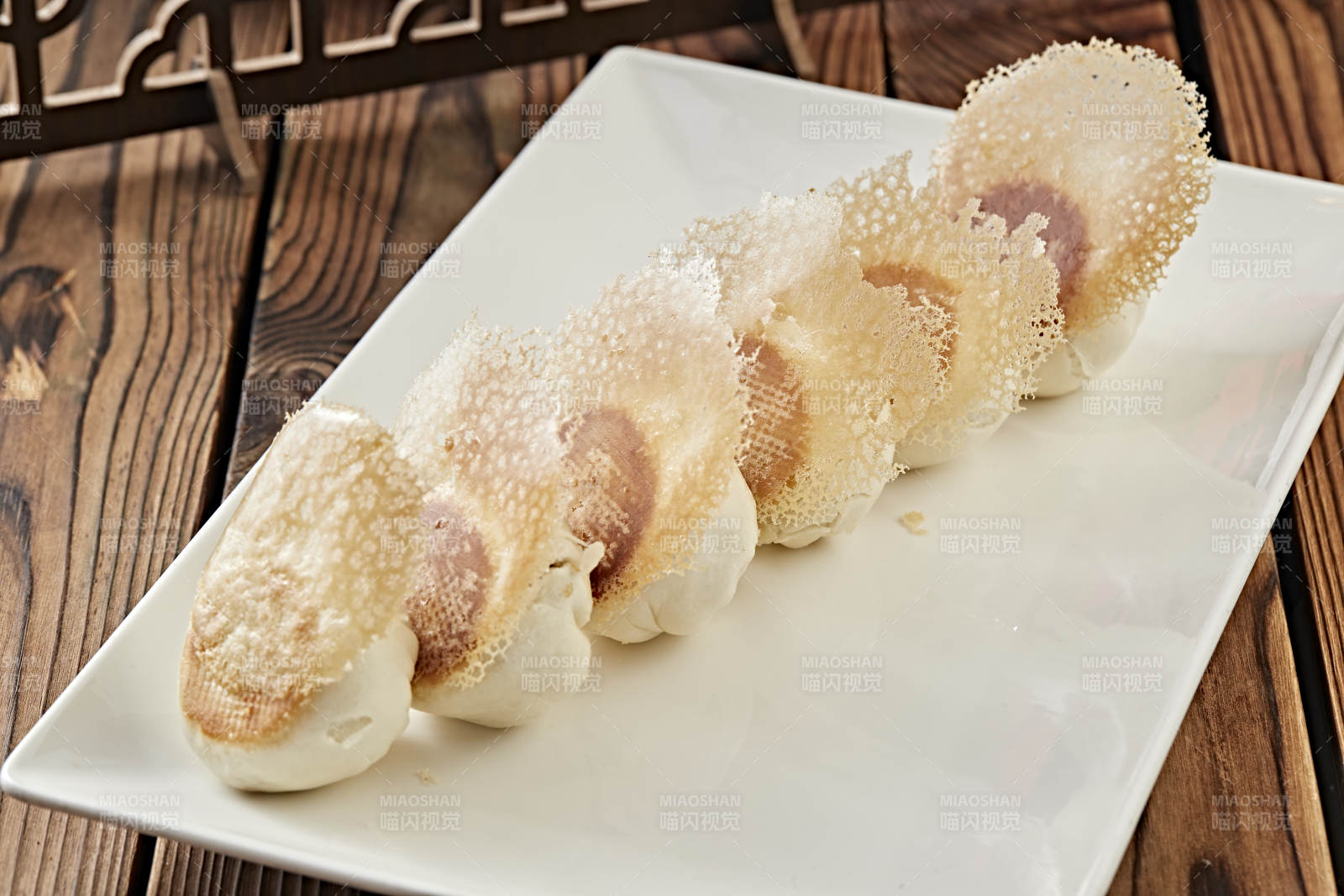 雪花渔网水煎包图片