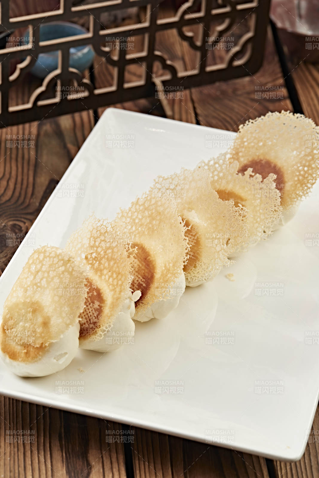 雪花渔网水煎包图片