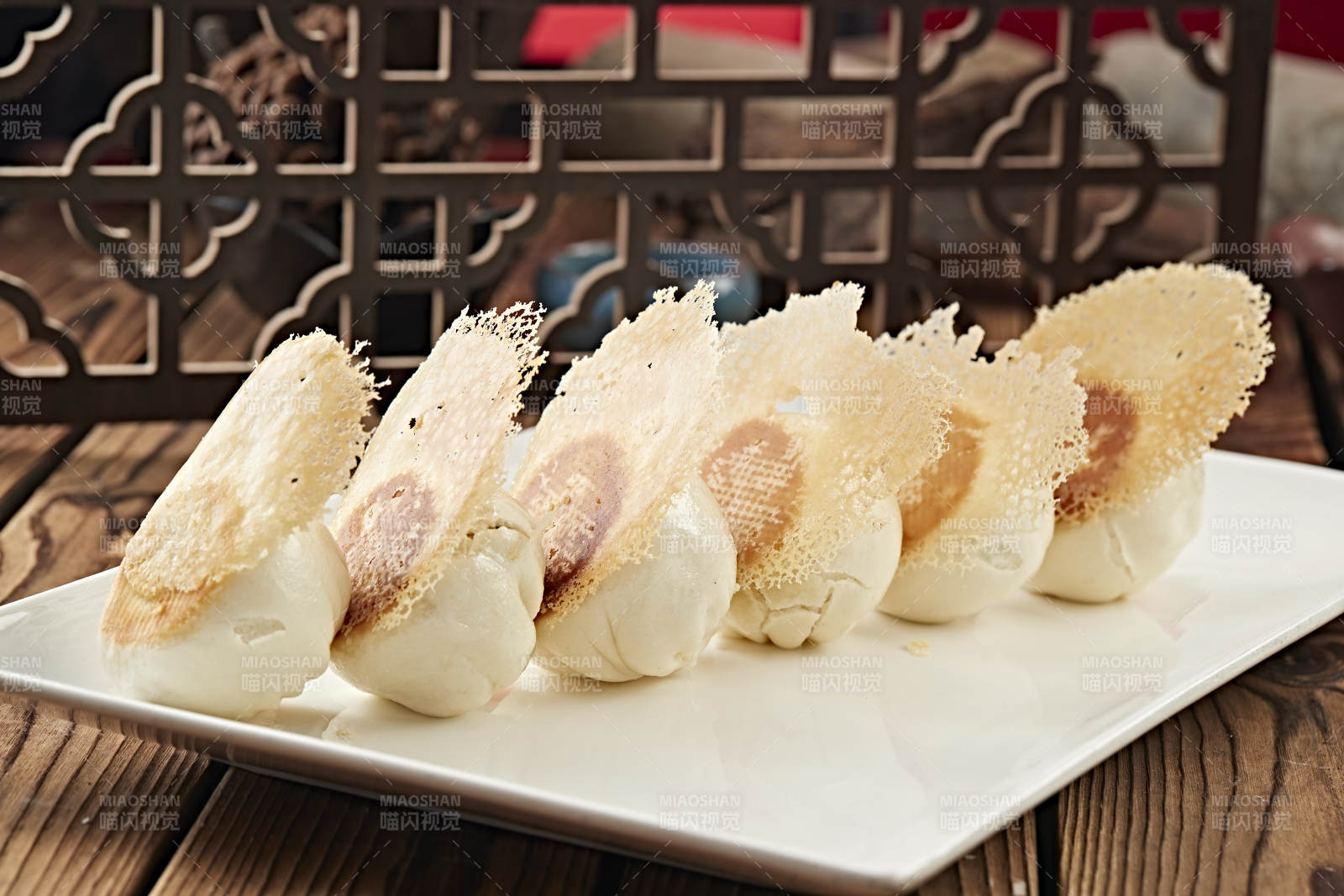 雪花渔网水煎包图片