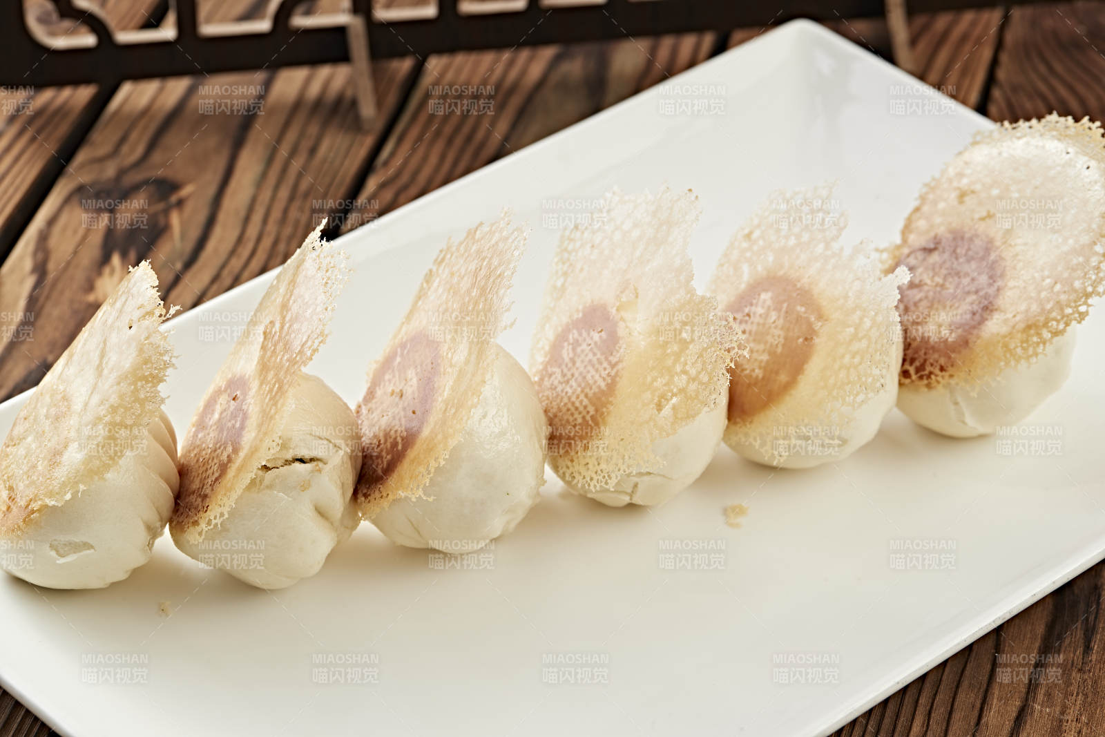 雪花渔网水煎包图片