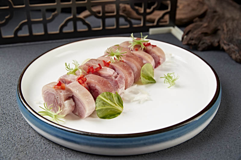 卤味压猪肘花卷切片图片