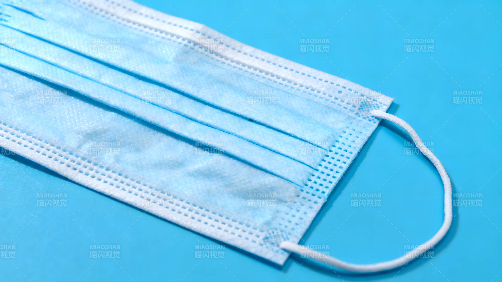 蓝色口罩特写照片图片