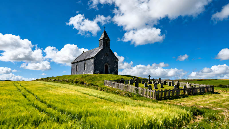 教堂墓地蓝天白云绿草地图片