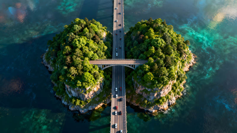 桥梁连接岛屿车流穿梭自然风光图片