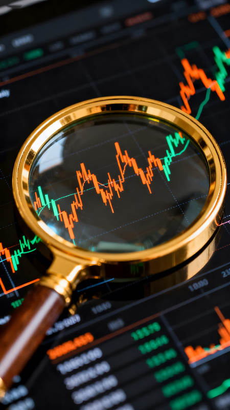 放大镜下的股票市场波动图图片