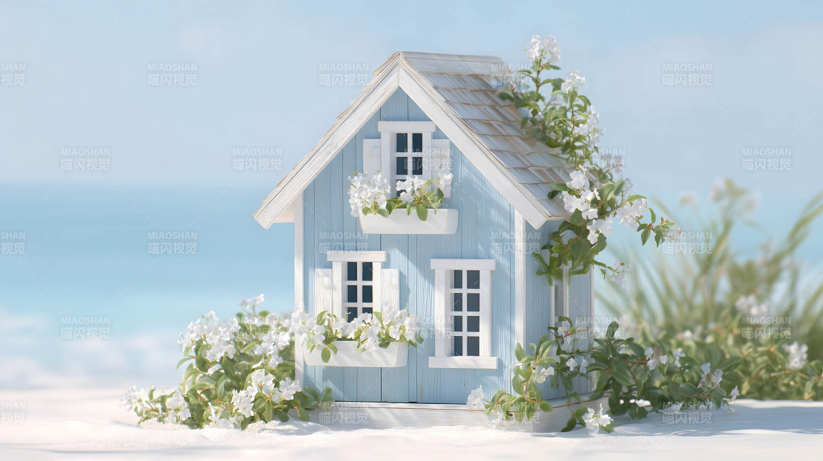 海边小屋与鲜花盛开图片