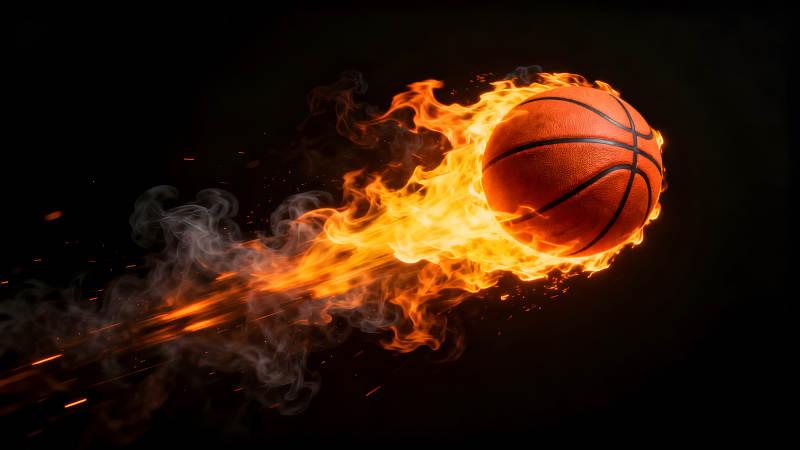 燃烧的篮球在黑暗中闪耀图片