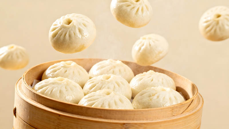 蒸笼里的包子和悬浮的包子图片