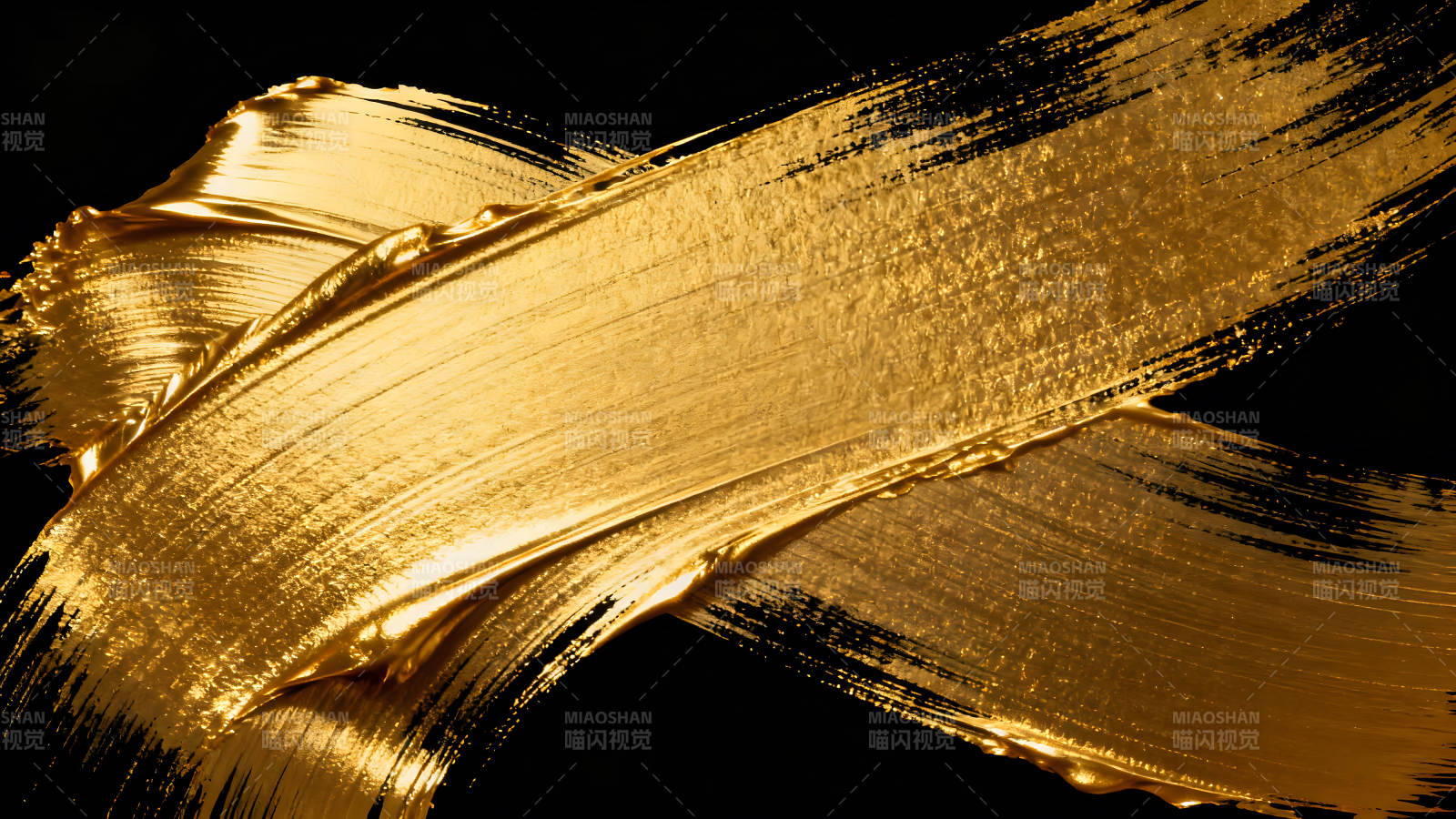 金色笔刷在黑色背景上的抽象艺术图片