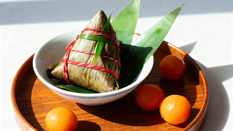 端午节粽子与金桔的搭配图片