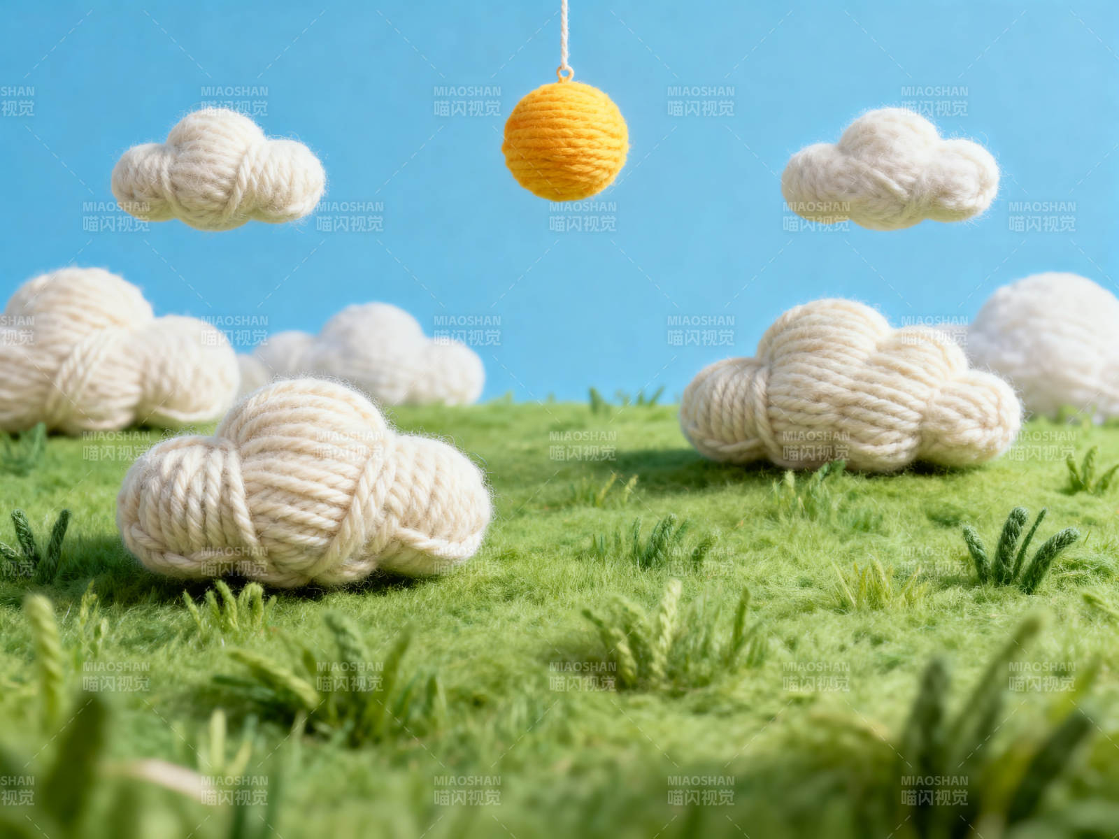毛线云朵与太阳的草地场景图片