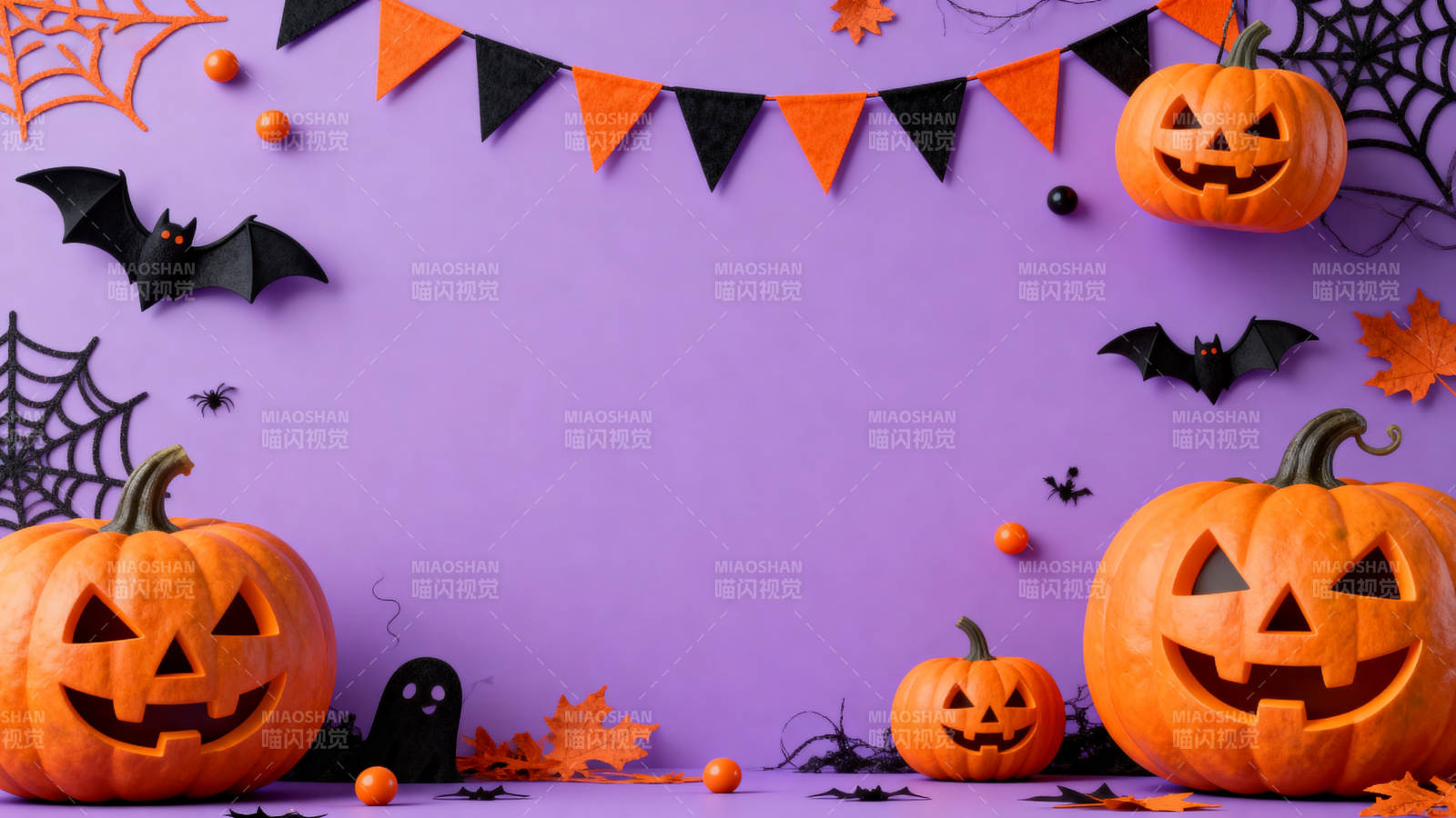 紫色背景下的万圣节南瓜装饰图片