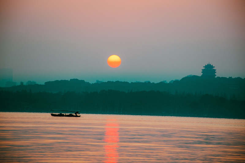 杭州西湖西冷桥日出图片