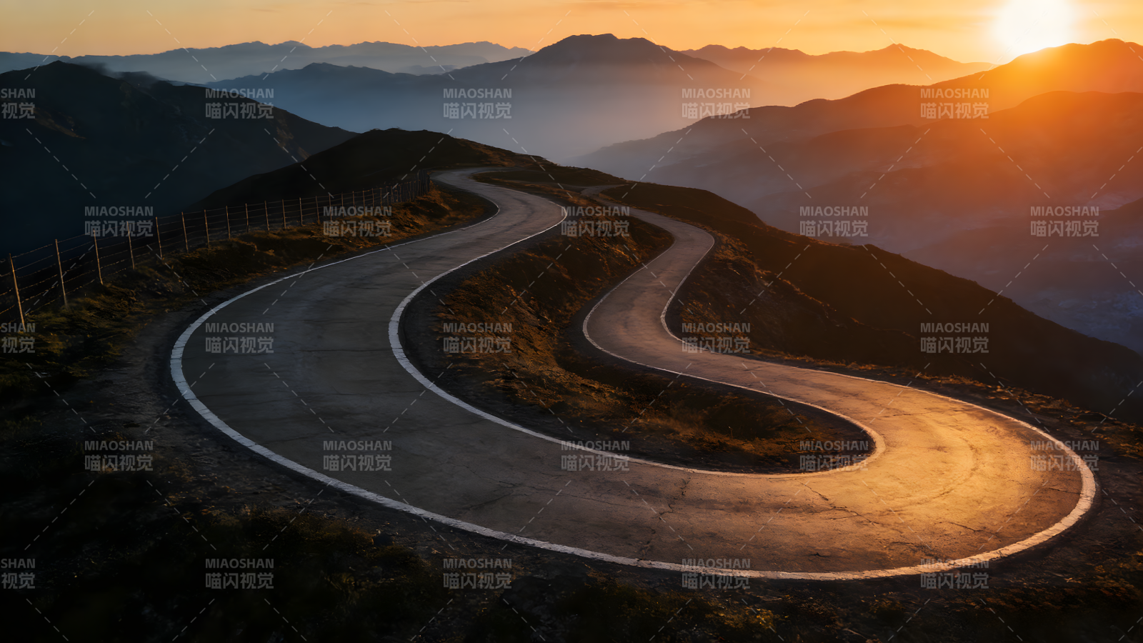 山路蜿蜒入夕阳图片