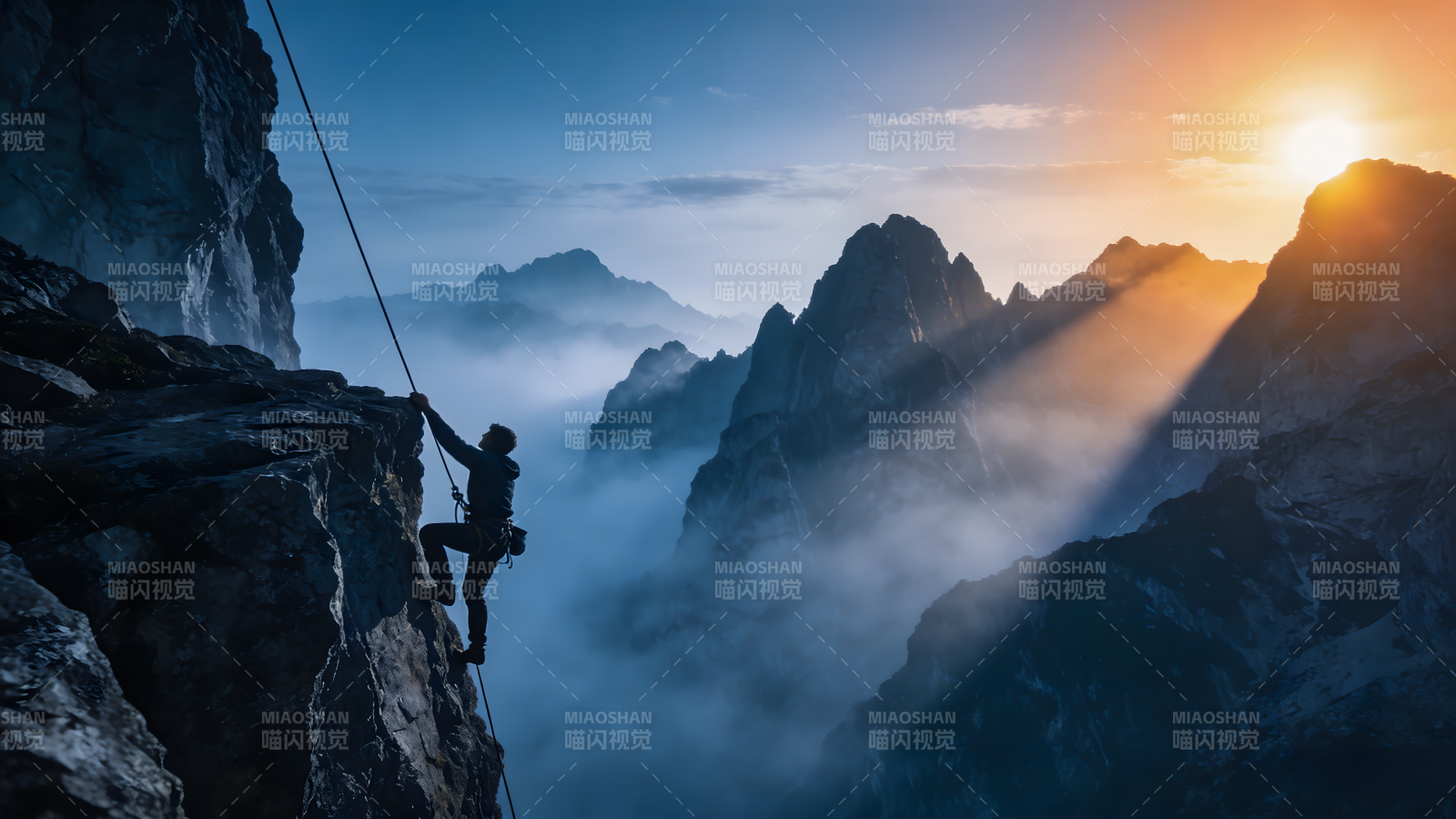 攀岩者征服高峰图片