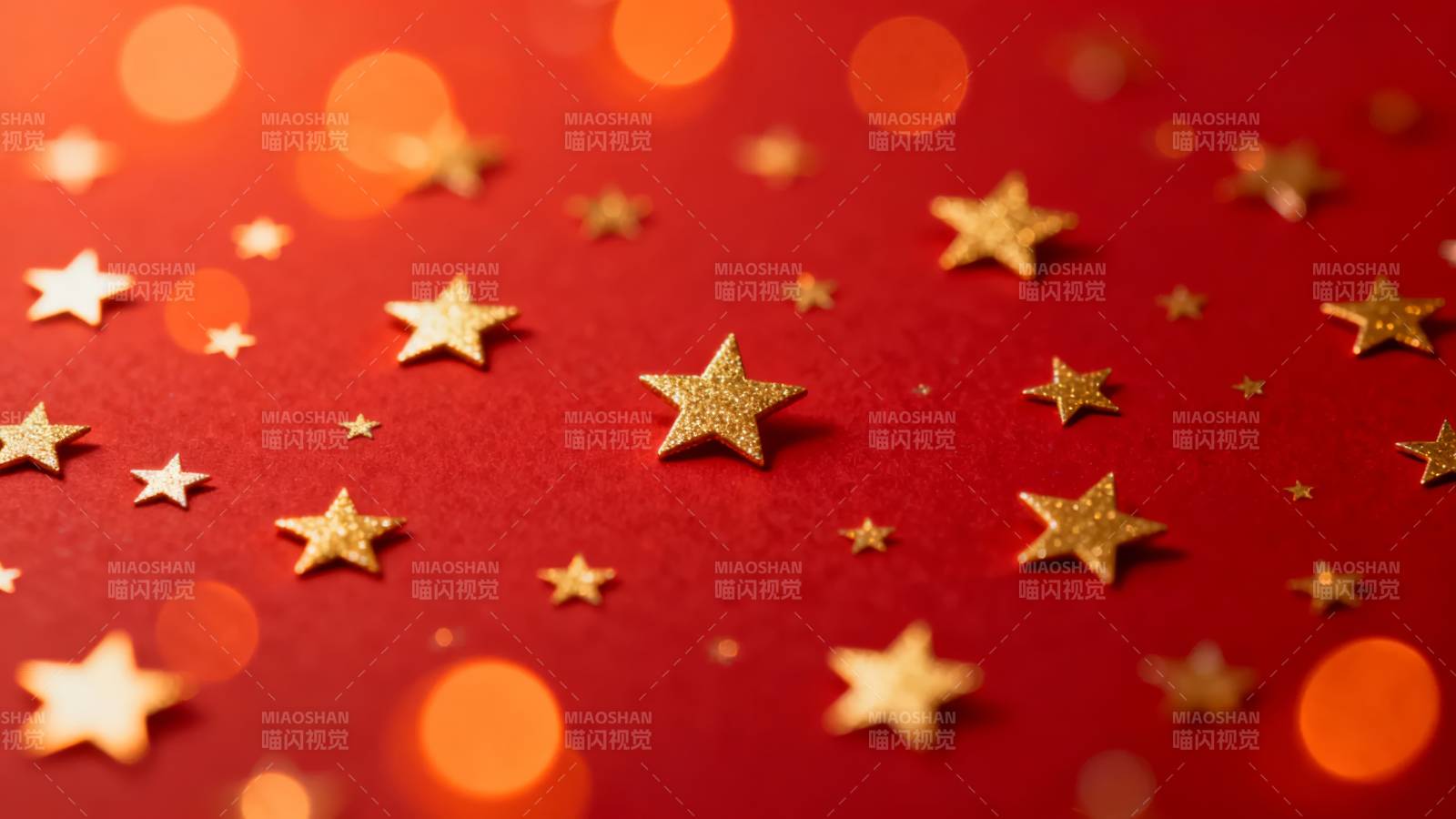 金色星星点缀红背景图片