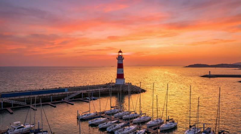 灯塔日落美景图片