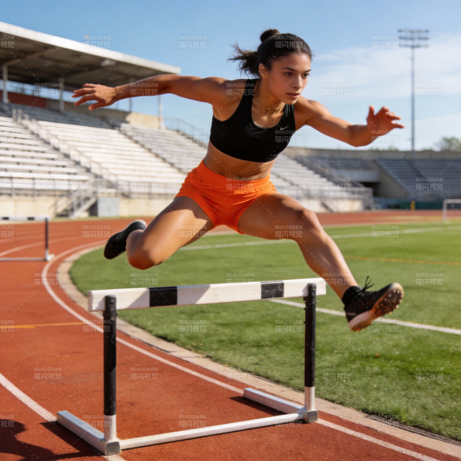 跨栏运动员跃过障碍图片